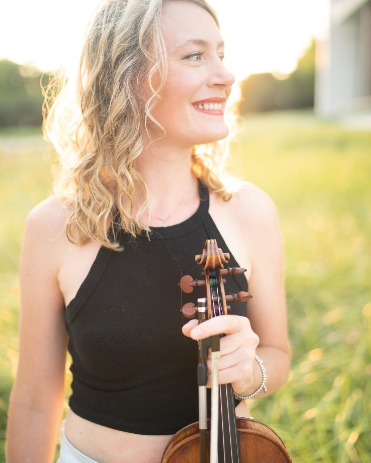 Photo of Katie Grennan holding a vioilin